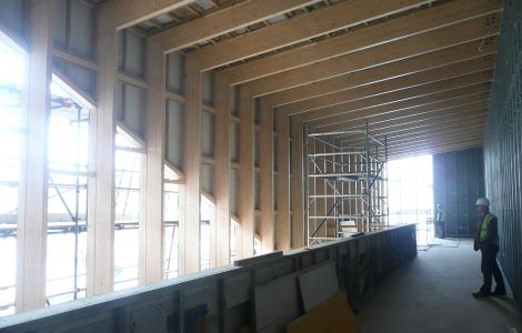 Upstairs in the long cafe/bar, the slanted window on the left blends in with the shape of the cinema roof when seen from Hay's Dock. The window at the far end looks out towards Holmsgarth and the NorthLink ferry berth. Here will be comfy seats and free wi-fi.