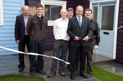 Cutting the ribbon on Quoys Phase Three on Friday: (from left) Drewie Manson - E & H Builders, Adrian Wishart - Richard Gibson Architects, Paul Leask - Hjaltland Housing Association, Bobby Elphinstone - E & H Builders, Jeff Goddard - Hjaltland Housing Association, Bryan Leask - Hjaltland Housing Association. Pic. Billy Fox