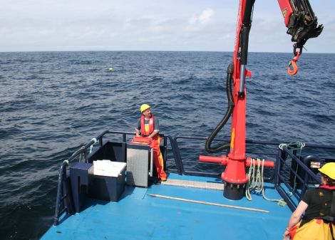 Staff from NAFC Marine Centre deploy Aegir Wave Power's Waverider test buoy off St Ninian's Isle to measure the power of the seas off Shetland.