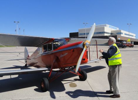 Pilot Dick Felix starting up the engine of the 1936 Hornet Moth