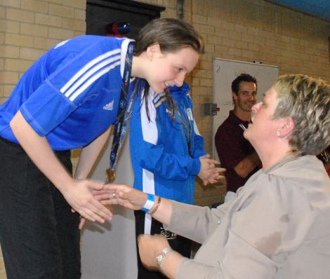 Andrea Strachan receiving her fourth gold medal of the games