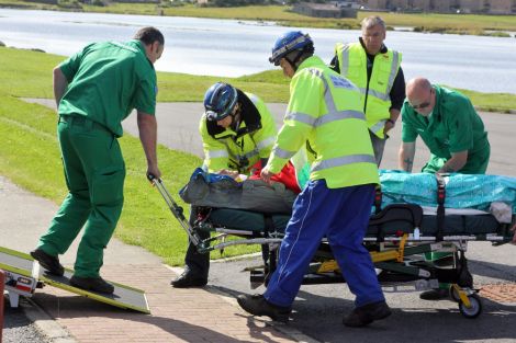 Crewman from oil standby vessel Enea being stretchered to GBH. Pic. Craig Sim