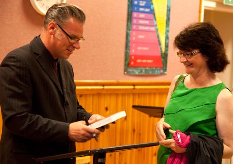 Film buff and Screenplay curator Mark Kermode handing a signed copy of his new book to fan Karen Fraser. Pic. Billy Fox