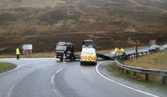 Police clear away a vehicle at Brig o Fitch after Monday morning's rush hour crash. Pic. Geoff Leask