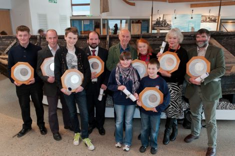 The winners of this years Shetland Environmental Awards (from left to right): Magnus Gear, Foula Community Electricity Trust; Peter Tait, DITT: Connor Dickson, Sandwick Junior High School; Colin Dickie Northmavine Community Development Company; Laughton Johnston, with Jill Blackadder, on behalf of the Field Studies Group; Kiera Munro & Steven Garriock, Dunrossness Primary School; Rosa Steppanova, Lea Gardens and Jonathan Wills, Seabirds and Seals - Photo: Austin Taylor