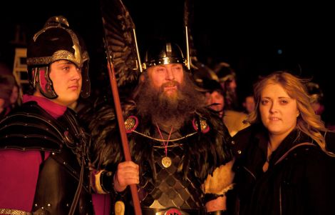 The Guizer Jarl with son Stuart and daughter Suzanne in reflective mood at the burning site.