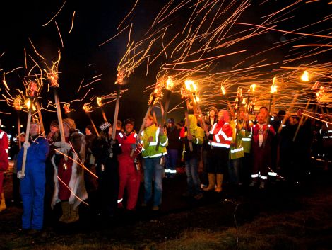 Sparks fly during the procession