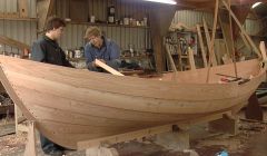 Fair Isle boat builder Ian Best and his son Tom work on one of the two yoals for the film Between Weathers - Photos: Liz Musser