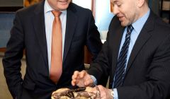 Fisheries secretary Richard Lochhead (left) invites NAFC Marine Centre's head of fisheries science Dr Martin Robinson to show him just how hard a crab can grip someone's finger. Pic. Billy Fox