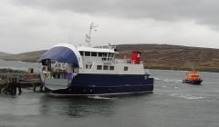 The ferry Linga berthing at Lax with the Lerwick, lifeboat standing by - Photo: Hans J Marter