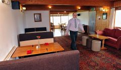 Steven Swan in the refurbished Baltasound Hotel - Photo: Malcolm Younger for HIE