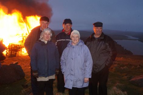 Five Unst residents who remember the Queen's coronation bonfire on top of Saxa Vord 59 years ago return for a repeat performance. From left: Willie Mouat, Minnie Mouat, Andrew Magnie Thomson, Edna Nisbet, Willie Henderson. Back then they were 6, 4, 16, 13 & 12. Pic. Ruth Grainger