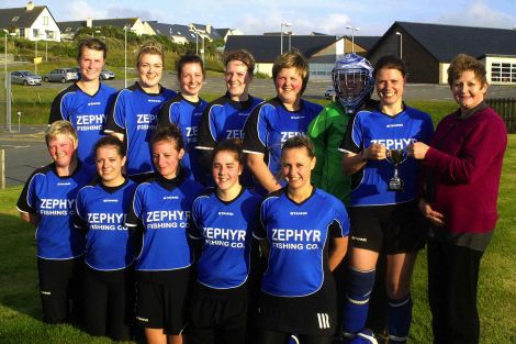 Dianne Davies presents the Mid Brae Inn cup to Whalsay. Back row: Ellie Simpson, Shelley Sandison, Natalie Polson, Emily Henderson, Deborah Mowat, Dianne Shearer, Maree Simpson (captain,) Diane Davies. Front row: Angelina Jamieson, Zoe Irvine, Nicola Duthie, Abbey Irvine, Catherine Williamson