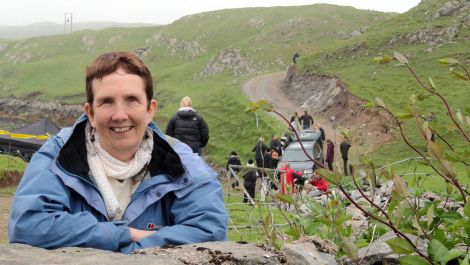 Crime writer Ann Cleeves in South Whiteness on Wednesday with the 'crime scene' in the background - Photos: Shetland News