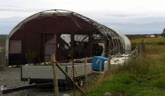 The remains of the boat in the burnt out polytunnel in Girlsta - Photo: Shetland News