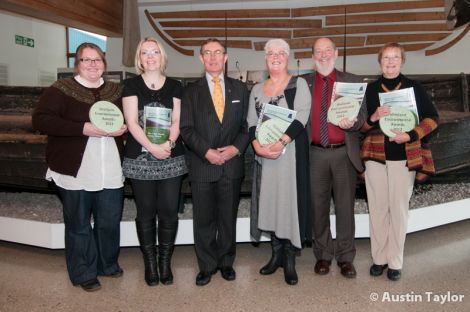 Captain George Sutherland (centre) of the Northern Lighthouse Board presented awards to (from left) Julie Thomson and Cheryl Jamieson of Gardiesfauld, Beth Gerrard of Sandgarth, Rick Nickerson who set up Da Voar Redd Up and Cecilia James. Pic. Austin Taylor