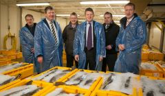 At Lerwick fish market on Tuesday morning. From left: SFA chairman Leslie Tait, local MP Alistair Carmichael, Shetland Seafood Auctions' Martin Leyland, UK fishing minister Richard Benyon, SFA chief executive Brian Isbister and local MSP Tavish Scott. Pic. Ben Mullay