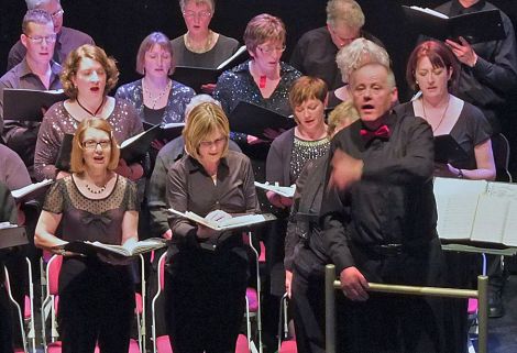 Conductor Peter Davis with some of the sophranos and tenors - Photo: Chris Brown