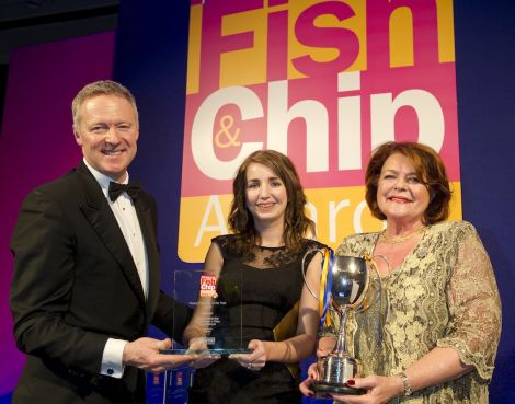 Fish frying princess Carlyn Kearney accepts her award from comedian Rory Bremner alongside award sponsor Briar Wilkinson. Pic. Seafish