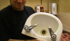 Turkish Delight proprietor Saban Kusmus with his new sink installed after repeated complaints from environmental health officers that he had no hot running water. Pic. SIC