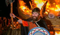 Uyeasound Guizer Jarl Colin Jamieson with his burning galley Uresvik - Photo: John Coutts