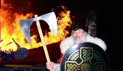 Guizer Jarl John Laurenson with his burning galley Aumstr - Photo: Mark Berry