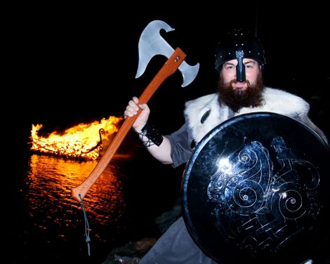 Guizer Jarl Barry Anderson with his burning galley.