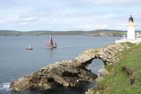 The Swan and the Pilot Us passing Bressay Lighthouse.