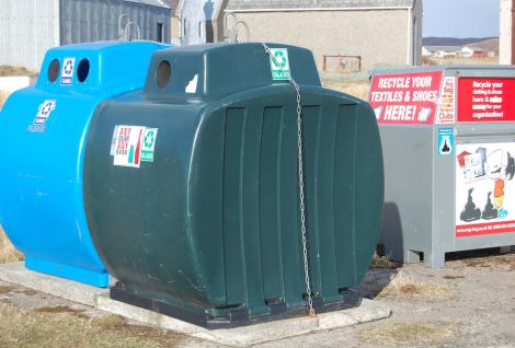 New council glass and metal recycling bins at Hillswick, with an extra bin from NCDC for clothes. Plastic and paper are too bulky for rural recycling in rural Shetland. Photo Shetland News