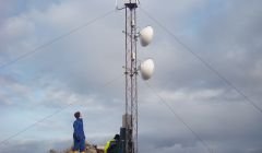 Connected! The mast with its turbine and dishes on top of Engamoor at West Burrfirth - Photo: Shetland Broadband