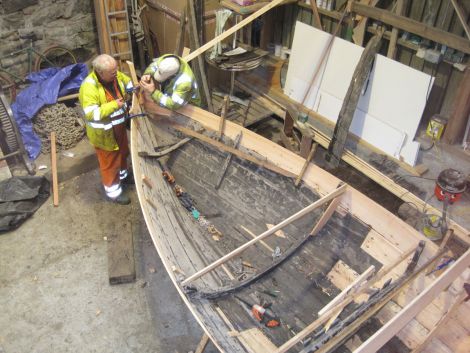 Local boat builders Jack Duncan and Robbie Tait restoring the Ann - Photo: Shetland Museum and Archives