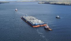 Kieran Murray's aerial shot shows Stema Barge 2 being towed into Lerwick harbour for shelter by the two Norwegian tugs Boa Balder and Afon Allow, escorted by the Lerwick harbour tug.