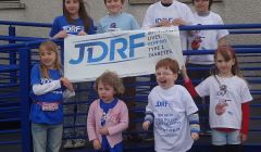 Some of the children in Shetland with Type 1 Diabetes and their siblings outside the Gilbertson games hall - Photo: Lynn Fraser