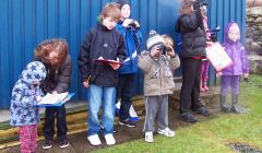 Dunrossness primary school P7 pupils teaching nursery kids in the art or birdwatching - Photo: Dunrossness Primary School