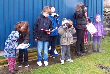 Dunrossness primary school P7 pupils teaching nursery kids in the art or birdwatching - Photo: Dunrossness Primary School