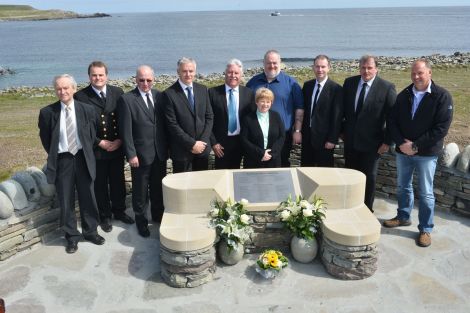 The Sumburgh Airport Memorial committee (from left to right): Allison Duncan, Aubrey Jamieson, Alan Sinclair, Nigal Flaws (chairman), Dave Ellis (treasurer), Pauline Nixon, Terry Williamson, Norman Sineath, Ronnie Leslie and Tom Jamieson. Also on the committee, but not on the photo, was Jim Livett - Photo: Malcolm Younger/Millgaet Media