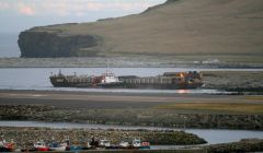 The shuttle barge Charlie Rock discharging Norwegian rock armouring at Wilsness last month. Photo George Jacobson