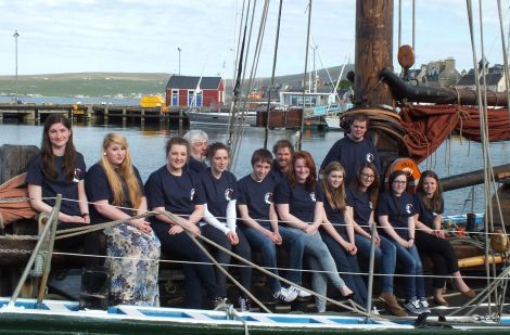 Ten of the 14 teenagers going on two exciting sailing trips this summer are (from left to right): Eve Maguire; Laura Hampton; Emma Cockerill; Valerie Robinson; Steven Anderson; Georgia Leask; Molly Brindley; Diana Inkster; Kate Tyler and Ailish Parham. With them are (back row): Sail Training Shetland chairman Peter Campbell, Swan skipper Richard Pattison and bosun Scott Sandison. Missing from the photo are: Orren Holt; Michaela Peterson; Heather Gray and Thomas Meadows.