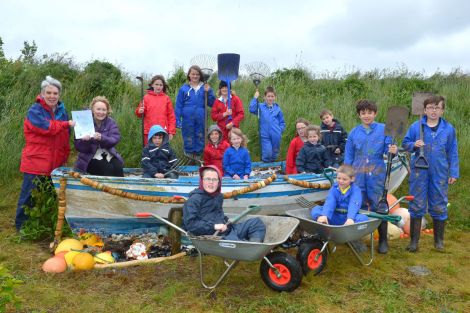 Celebrating success are (left to right back row) : Anna Perry, Amanda MacKay, Jolene Mackay, James Rendall; in the boat (left to right): Shaun Hoseason, Connor Fraser, Sophiea Down, Judy Hamer, Lily Rendall, David Bradley; front (left to right): Ewan Hutcheson, Morgan Fraser, Luke Malcolmson and Benjamin Hamer - Photo: Malcolm Younger/Millgaet Media