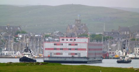 The accommodation barge is being towed into Lerwick harbour on Friday morning - Photo: John Bateson