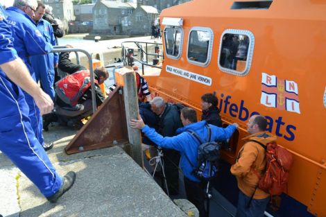 Passengers being brought ashore from the Lerwick lifeboat after being rescued from the tour boat Alluvion on Friday afternoon. Photo BBC