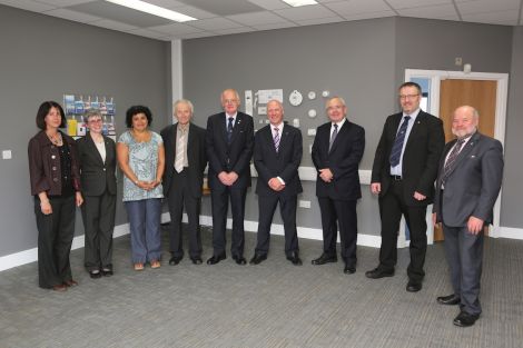 The council and the NHS celebrate a joint success. From left: architect Suzanne Malcolmson (Redman+Sutherland); SIC corporate services director Christine Ferguson; SIC occupational therapy executive manager Jo Robinson; SIC social services vice chairman Allison Duncan; SIC social services chairman Cecil Smith; Scottish government minister for parliamentary business Joe FitzPatrick MSP; NHS Shetland chairman Ian Kinniburgh; SIC political leader Gary Robinson; and SIC development chairman Alastair Cooper. Photo Kevin Jones/SIC