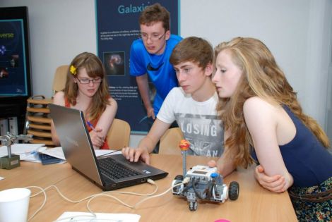 Astronomy day - Persephone Poulton, Aidan Redpath, Kirsty Uttley and Jack Simpson build a vehicle for their planet and program it to orbit its star (light bulb).