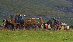 The concrete mixer is being bulldozed off the road - Photos: Ronnie Robertson