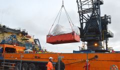 The wreckage of the Super Puma L2 helicopter being unloaded for onward transport at Lerwick harbour on Thursday - Photo: ShetNews