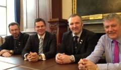 All hands together. Orkney Islands Council convener Steven Heddle, local government minister Derek Mackay, SIC leader Gary Robinson and Western Isles Council leader Angus Campbell after Thursday's meeting. Photo Scottish government