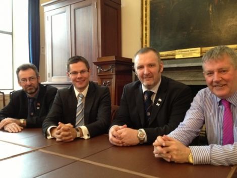 All hands together. Orkney Islands Council convener Steven Heddle, local government minister Derek Mackay, SIC leader Gary Robinson and Western Isles Council leader Angus Campbell after Thursday's meeting. Photo Scottish government