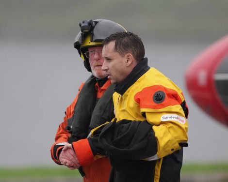 A passenger is guided off the rescue helicopter - Photo: Garry Sandison.