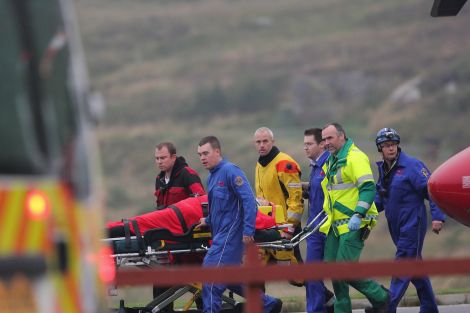 One casualty was taken on a stretcher to a waiting ambulance - Photo: Garry Sandison