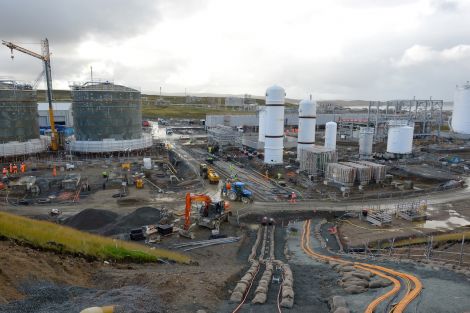 The busy construction site is soon to peak at 1400 workers. The grey tanks are water tanks for fighting fires, while the white tanks contain MEG (mono ethylene glycol) for extracting water from the gas. Photo Malcolm Younger/Millgaet Media